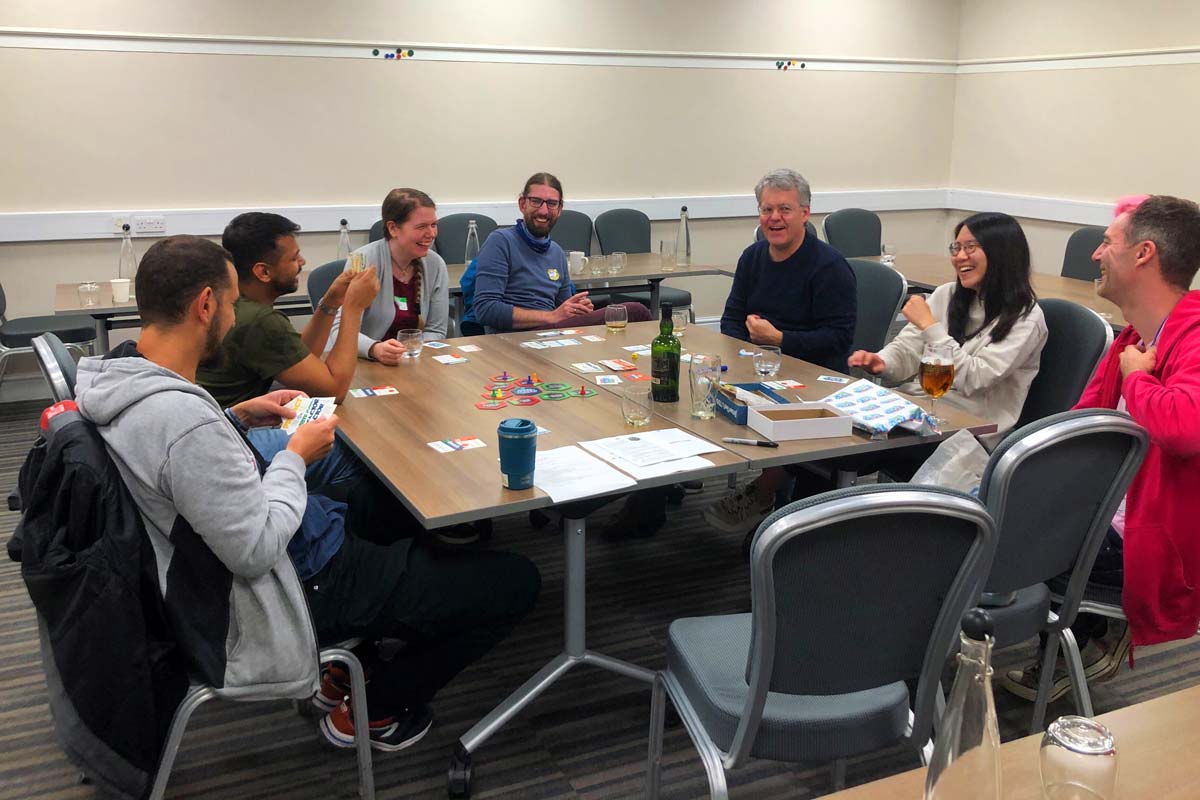 People playing the TDD board game at Socrates Unconference