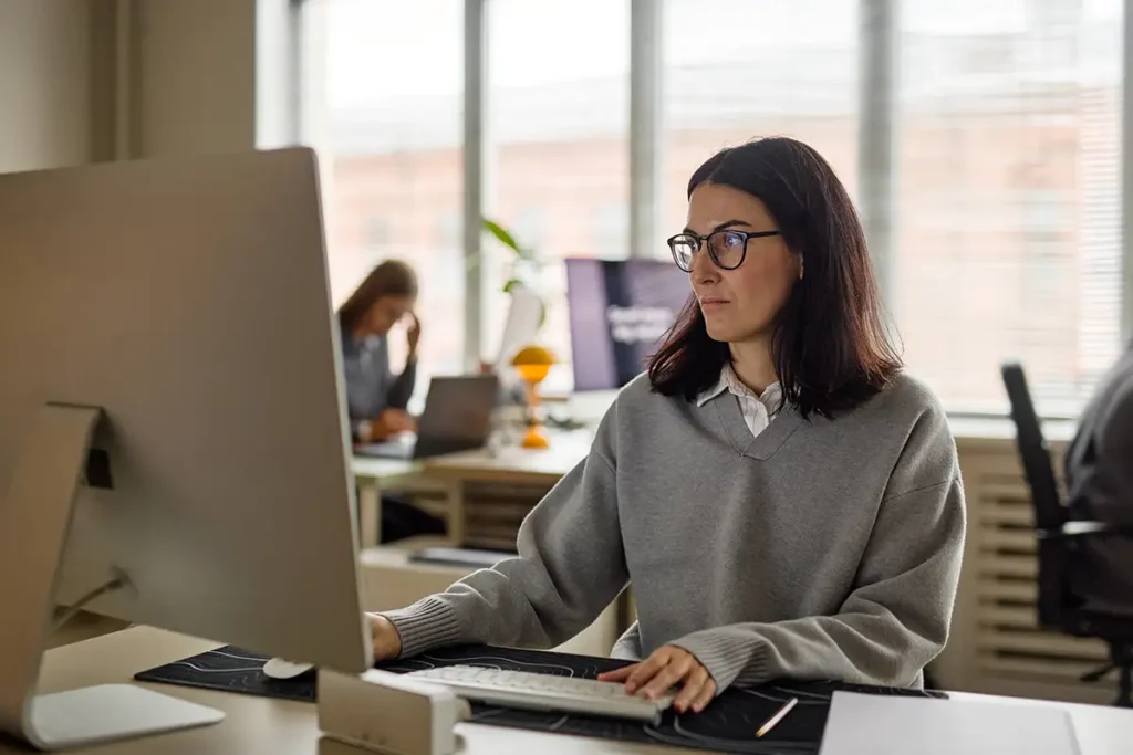AI adoption governance owner working in a modern office